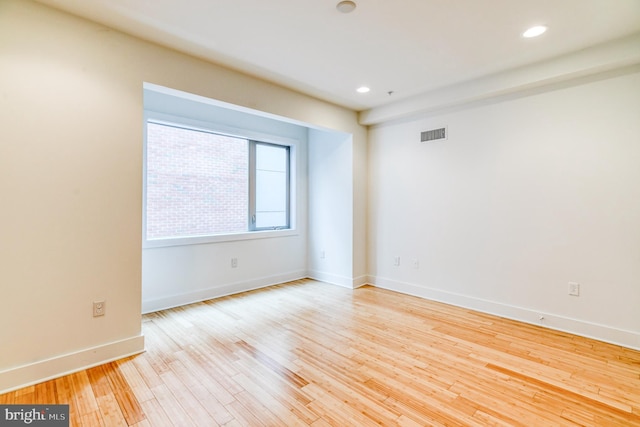 unfurnished room featuring light hardwood / wood-style flooring