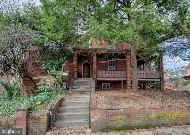 view of front of home featuring brick siding