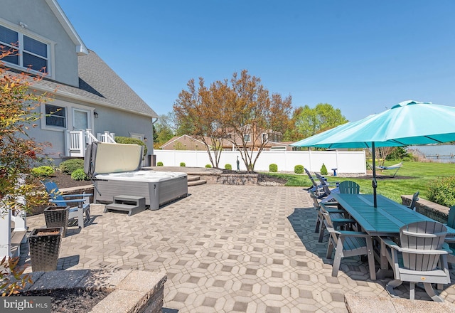 view of patio / terrace featuring a hot tub