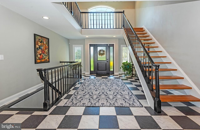 entryway with a towering ceiling