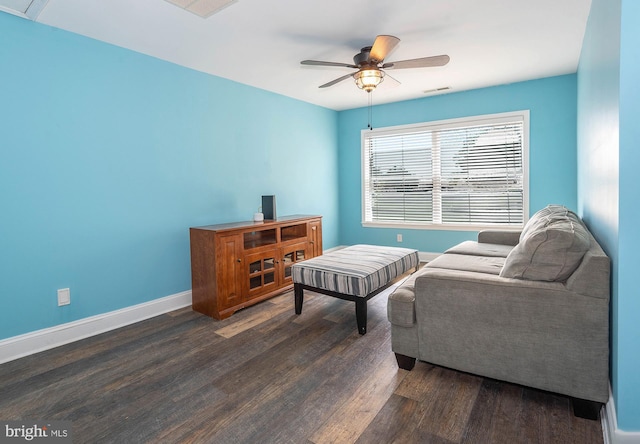 living room with ceiling fan and dark hardwood / wood-style floors