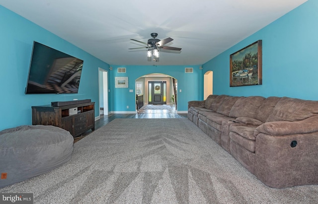 living room featuring hardwood / wood-style flooring and ceiling fan