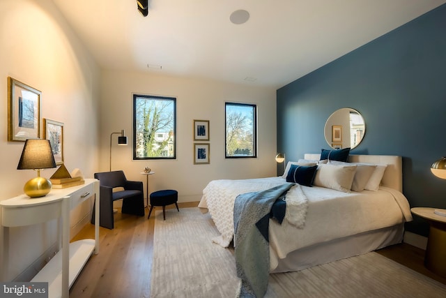 bedroom with light hardwood / wood-style floors