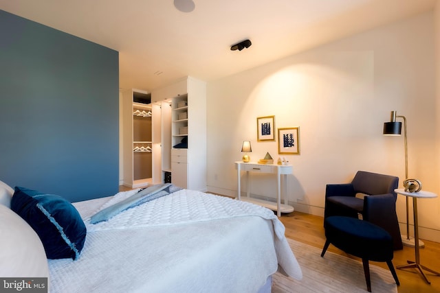 bedroom featuring wood-type flooring