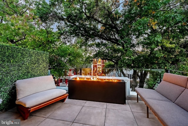 view of patio / terrace featuring an outdoor fire pit