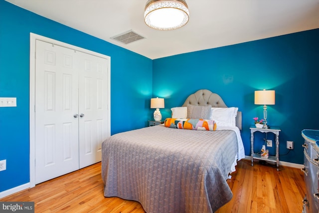 bedroom with a closet and light wood-type flooring