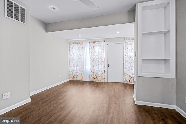 unfurnished bedroom featuring dark hardwood / wood-style flooring