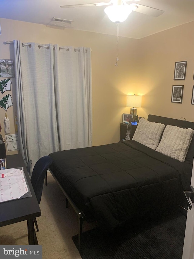 carpeted bedroom with ceiling fan