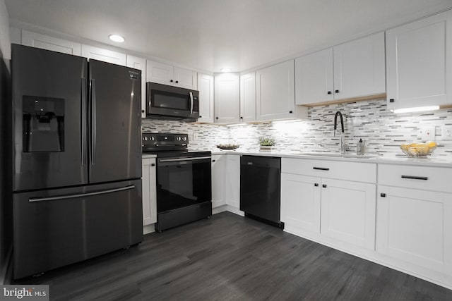 kitchen with white cabinetry, sink, dark wood-type flooring, and black appliances