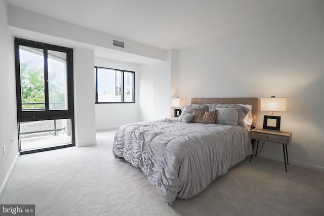 bedroom with light colored carpet