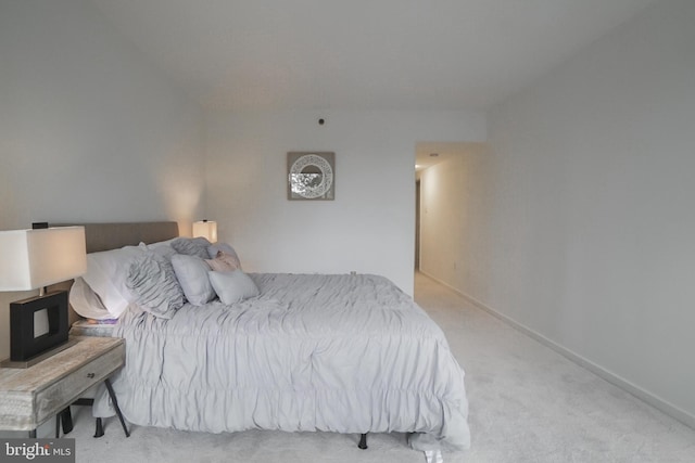 bedroom featuring light carpet