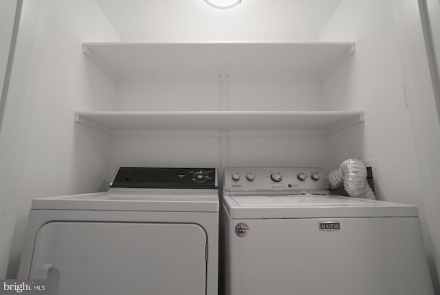 laundry room featuring washing machine and dryer