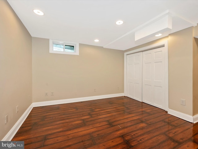 below grade area with recessed lighting, baseboards, and wood finished floors