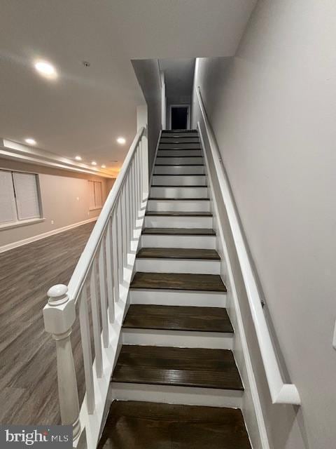 stairway featuring hardwood / wood-style floors