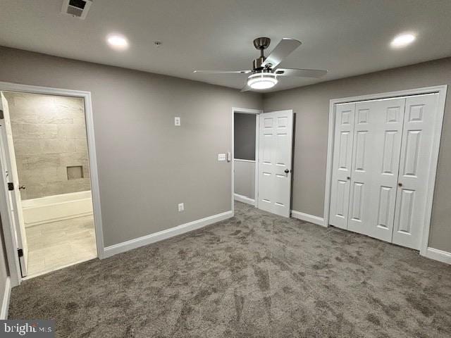 unfurnished bedroom with ceiling fan, a closet, ensuite bathroom, and carpet