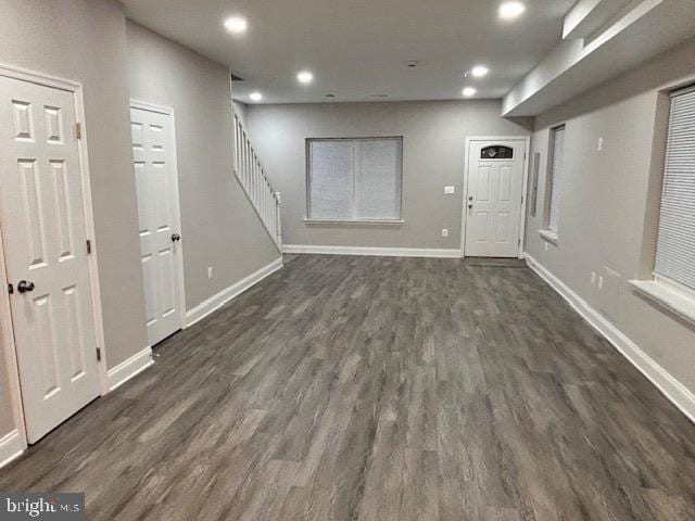 basement featuring dark hardwood / wood-style flooring