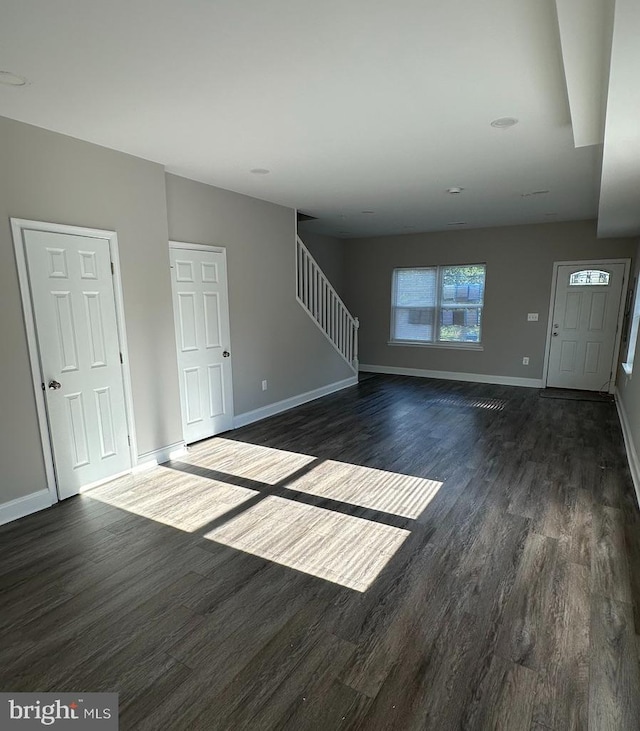 interior space with dark hardwood / wood-style floors