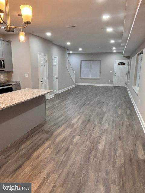 interior space with dark hardwood / wood-style flooring