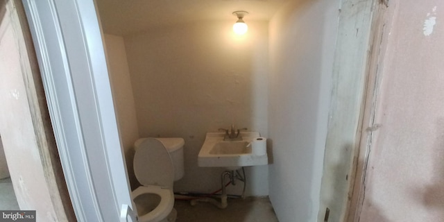 bathroom with sink and toilet