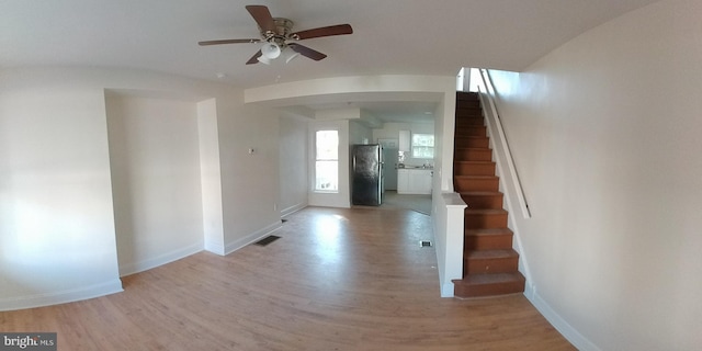 entrance foyer featuring ceiling fan and light hardwood / wood-style flooring