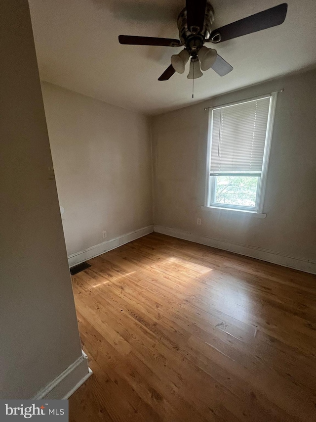 empty room with light hardwood / wood-style flooring