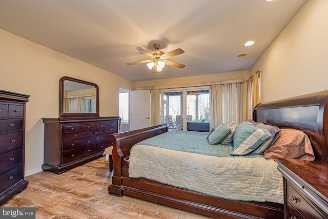 bedroom with ceiling fan, access to exterior, and light hardwood / wood-style floors