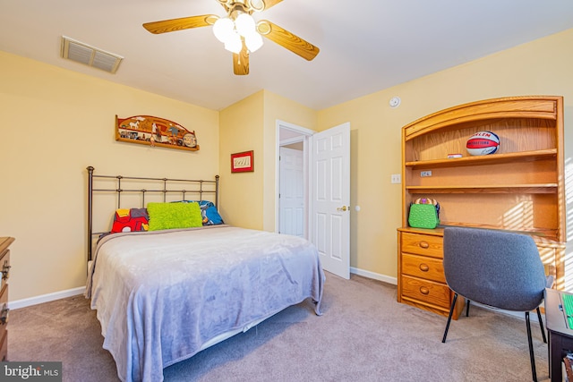 bedroom with light carpet and ceiling fan