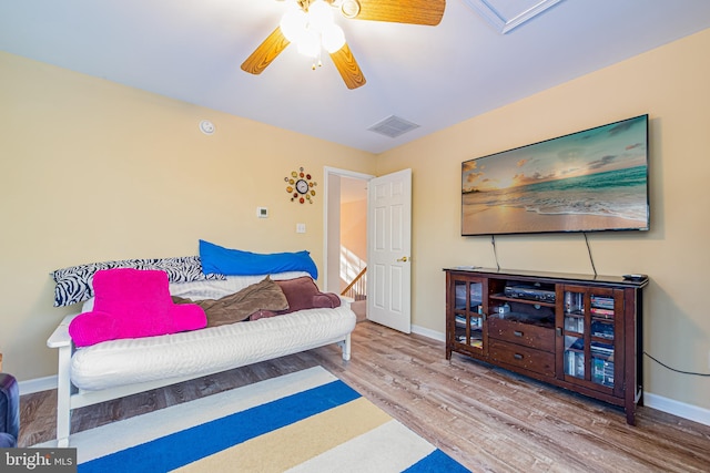 bedroom featuring wood-type flooring and ceiling fan