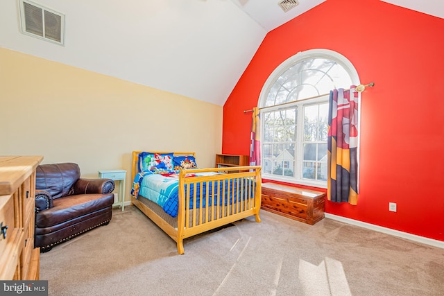 carpeted bedroom featuring lofted ceiling