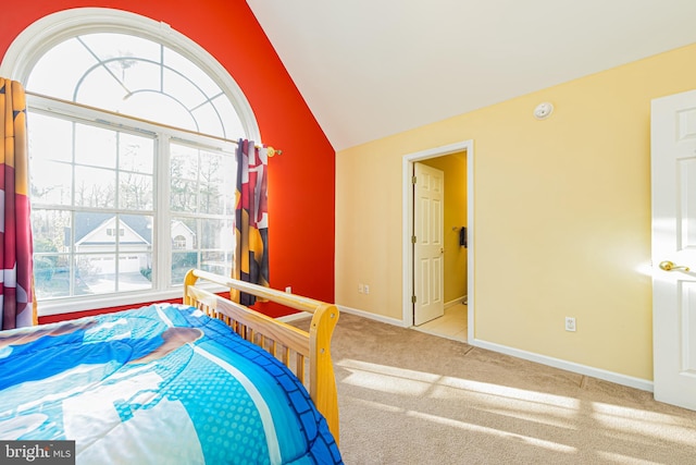 carpeted bedroom featuring vaulted ceiling