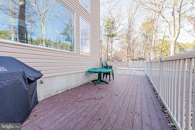 wooden deck with area for grilling