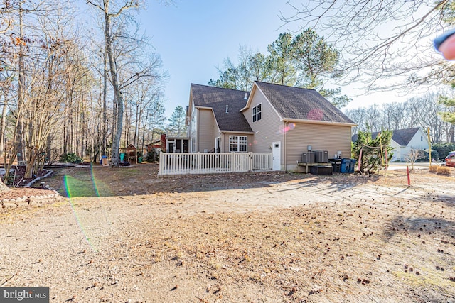 back of house featuring central AC unit