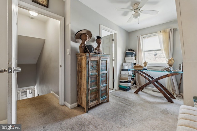 home office with light carpet and ceiling fan