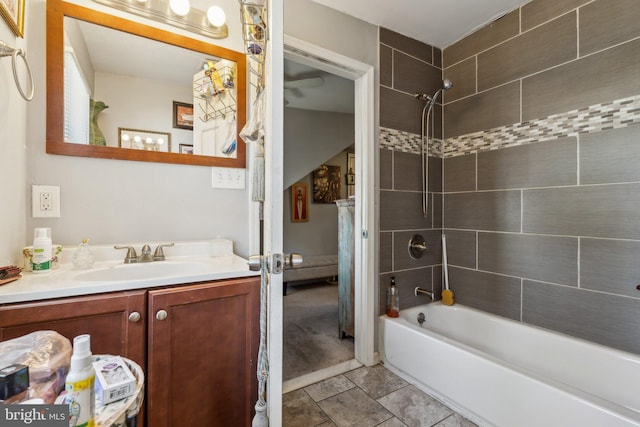 bathroom with vanity and tiled shower / bath