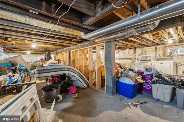 basement featuring washer and clothes dryer