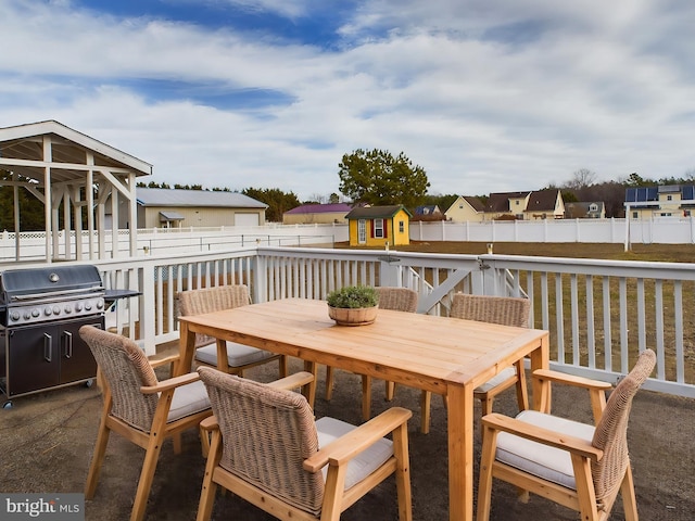 23338 Park Ave, Georgetown, DE 19947 - wooden terrace featuring a shed and a grill