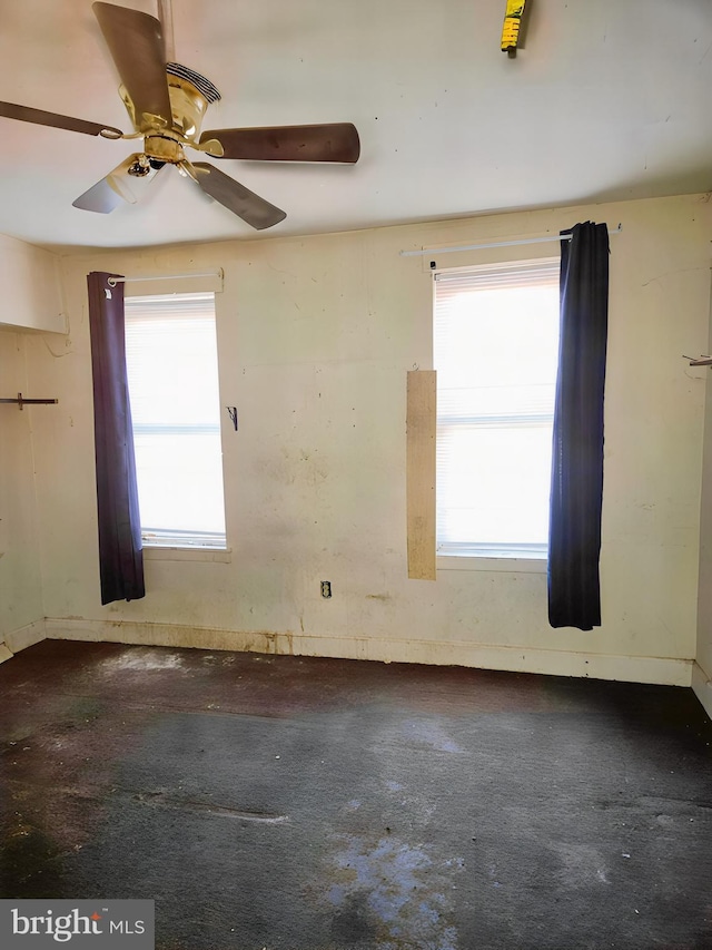 unfurnished room featuring a wealth of natural light