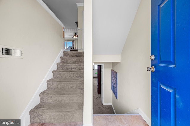 entrance foyer featuring crown molding