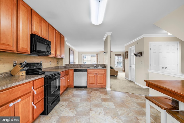 kitchen with sink, crown molding, black appliances, and decorative backsplash