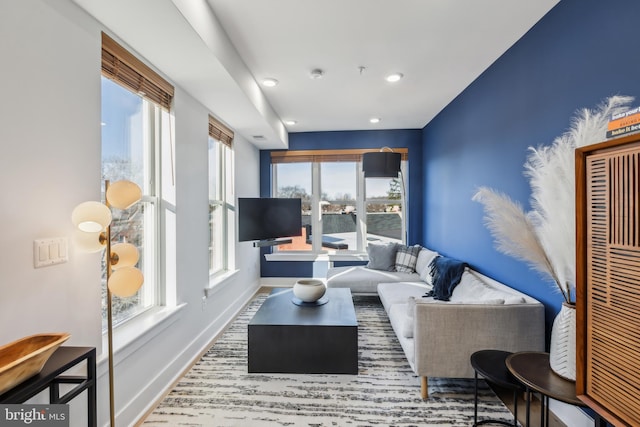 living area with recessed lighting and baseboards