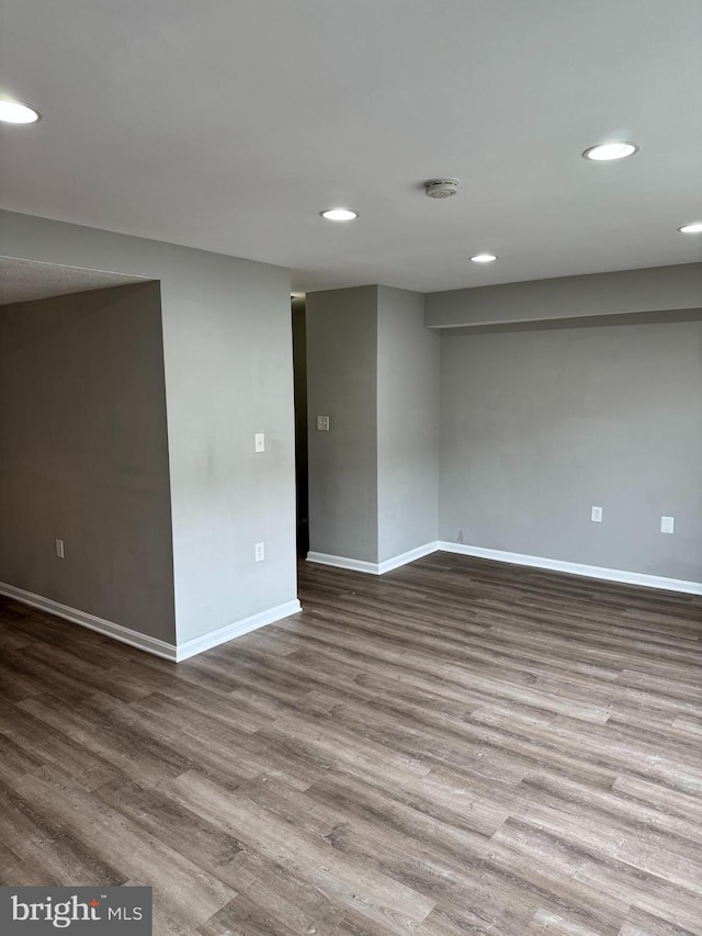 spare room with wood-type flooring