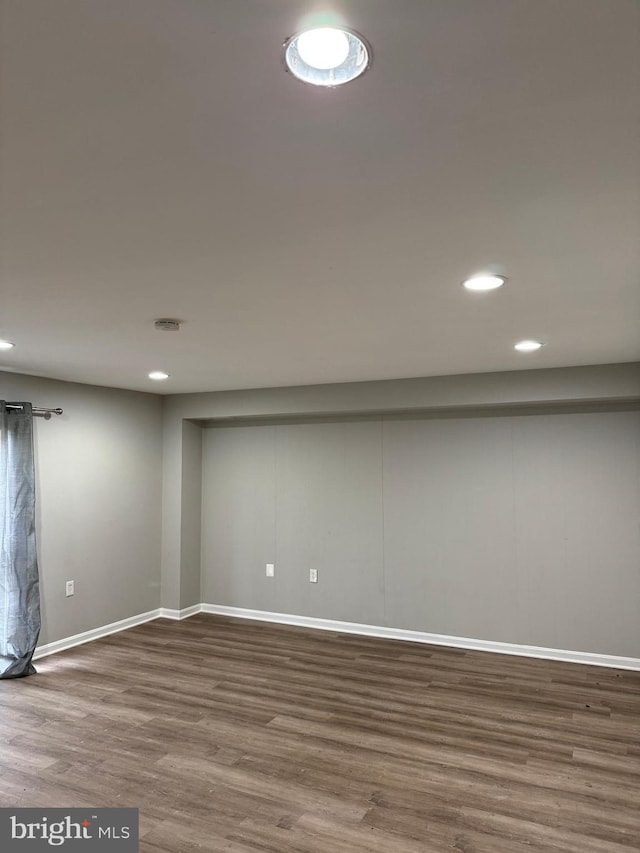 basement featuring hardwood / wood-style flooring