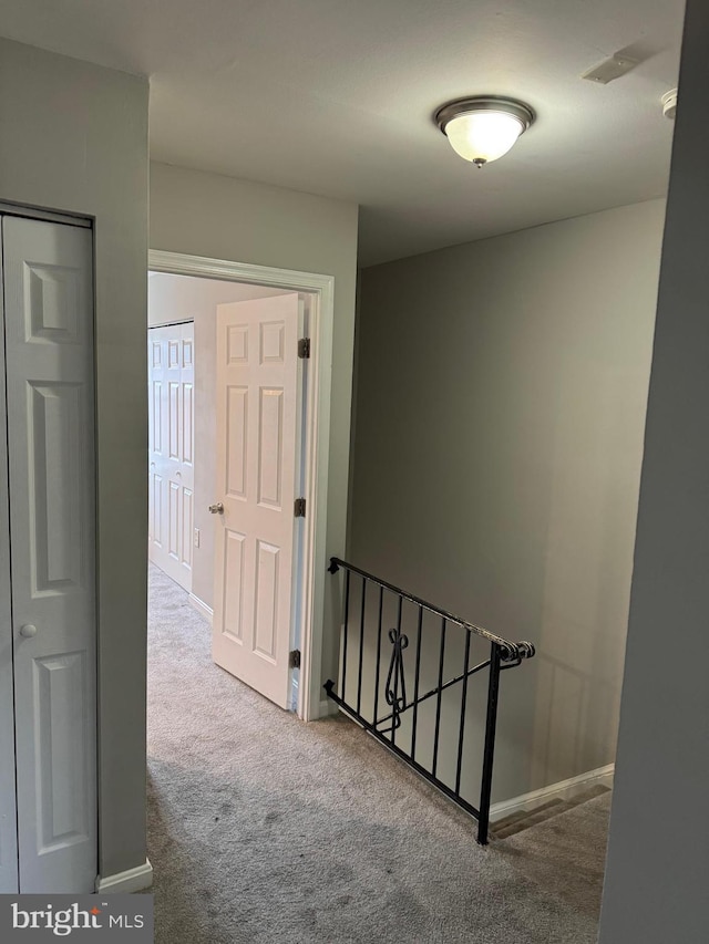 corridor featuring carpet flooring