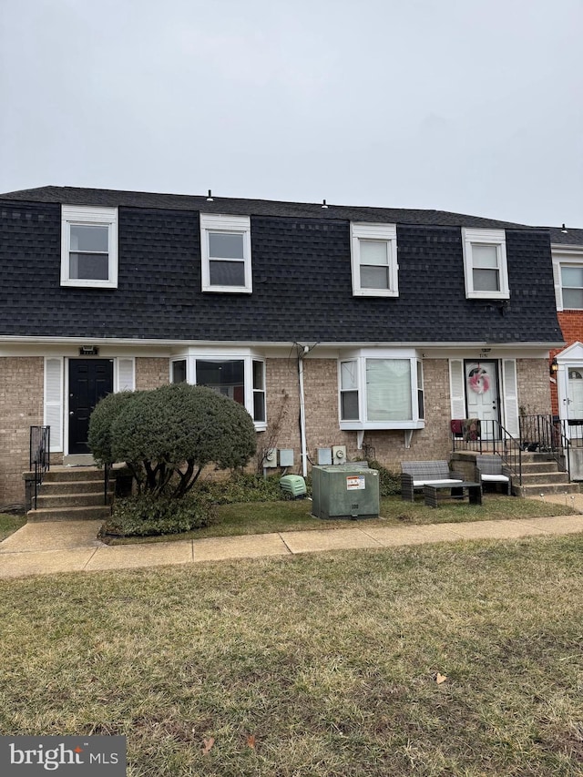 view of property with a front lawn