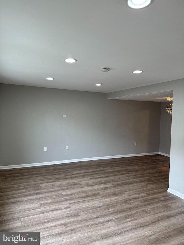 unfurnished room featuring hardwood / wood-style flooring