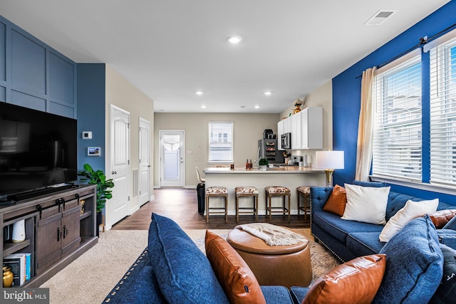 living room featuring dark hardwood / wood-style flooring