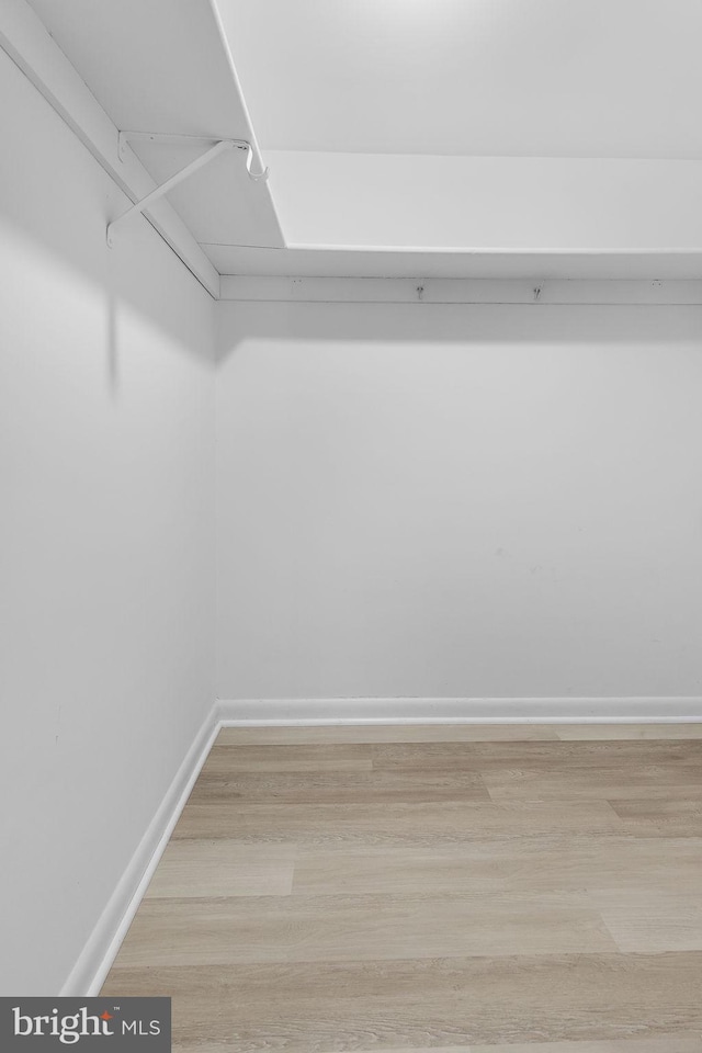 128 Roberts Ln Unit 301, Alexandria, VA 22314 - walk in closet featuring light wood finished floors