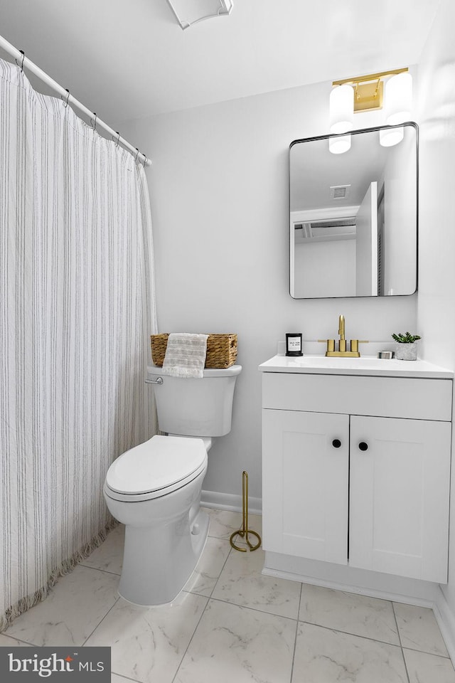 128 Roberts Ln Unit 301, Alexandria, VA 22314 - full bathroom with marble finish floors, vanity, toilet, and baseboards