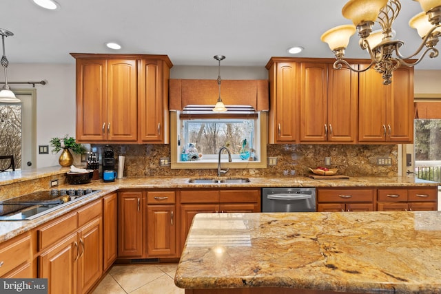 kitchen with hanging light fixtures, sink, black electric cooktop, and stainless steel dishwasher