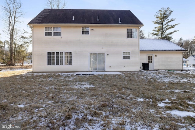 snow covered house with cooling unit